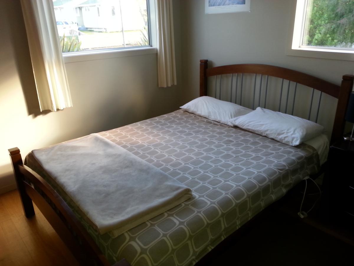 Riverstone Lodge Turangi Exterior foto A bed
